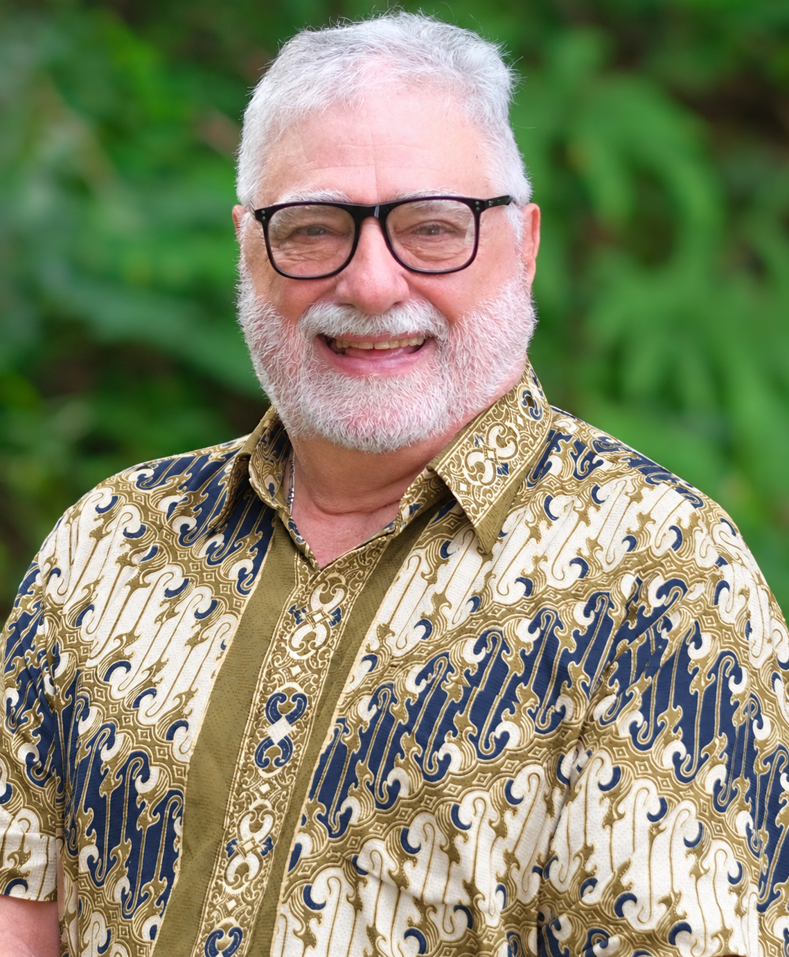 Mr Nicholas Combes wearing an ivory, navy and champagne-gold batik shirt